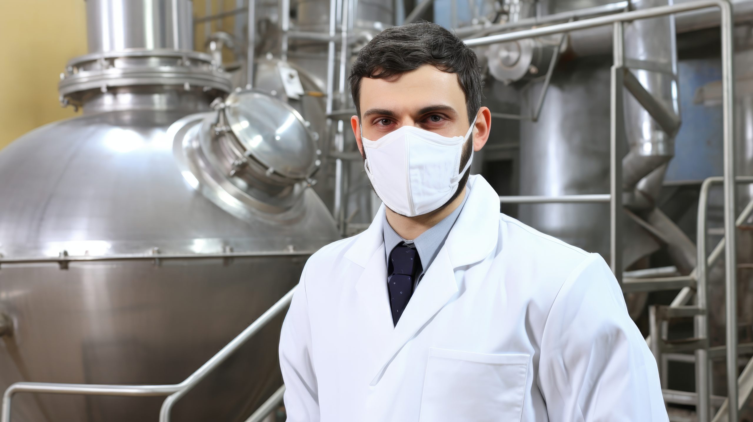 laboratory technician wearing protective mask conducting experiment research lab scaled